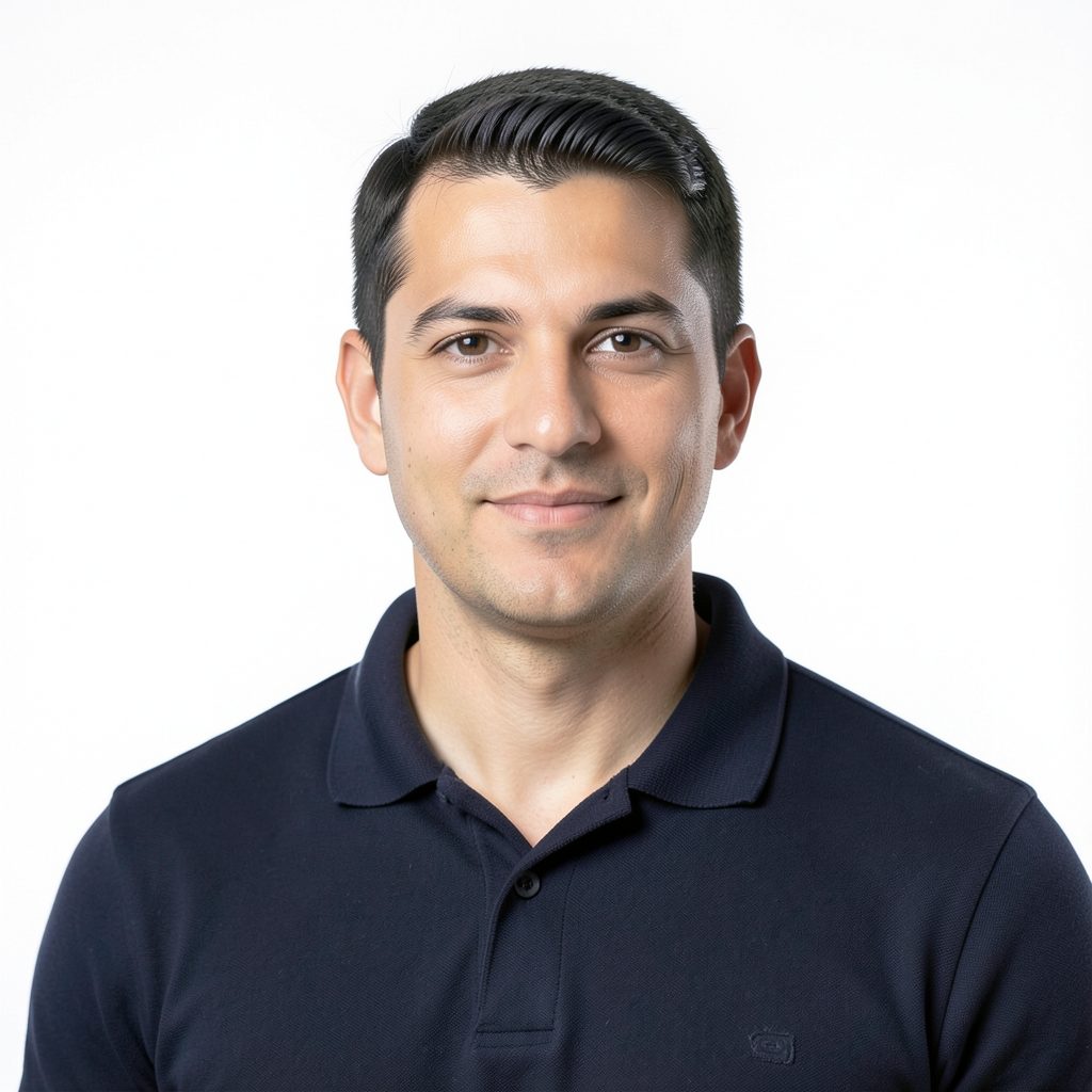Professional headshot placeholder with a dark polo against a clean white studio background